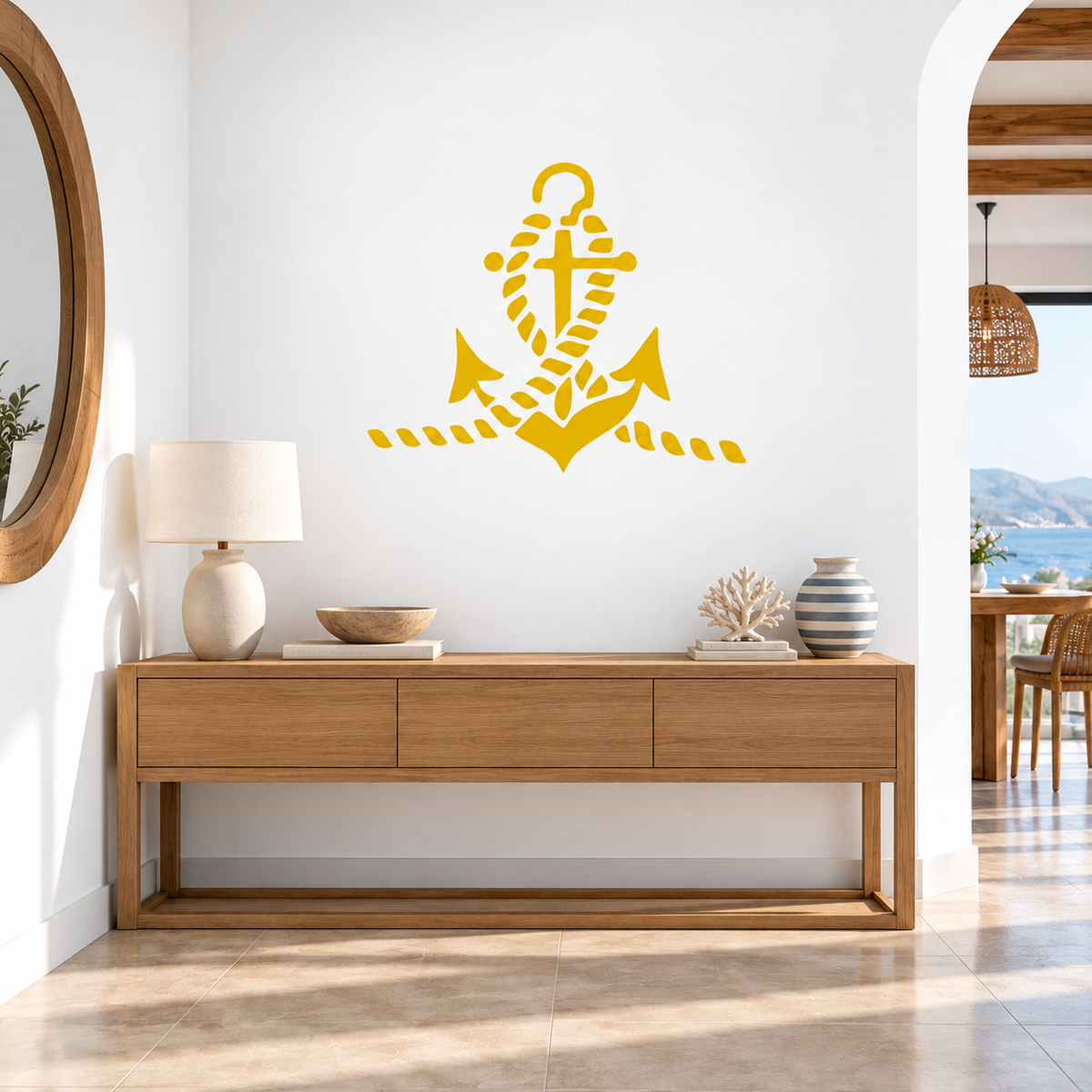Bright yellow Anchor and Rope Stencil on a white wall above a wooden console table in a Mediterranean-style coastal entryway.