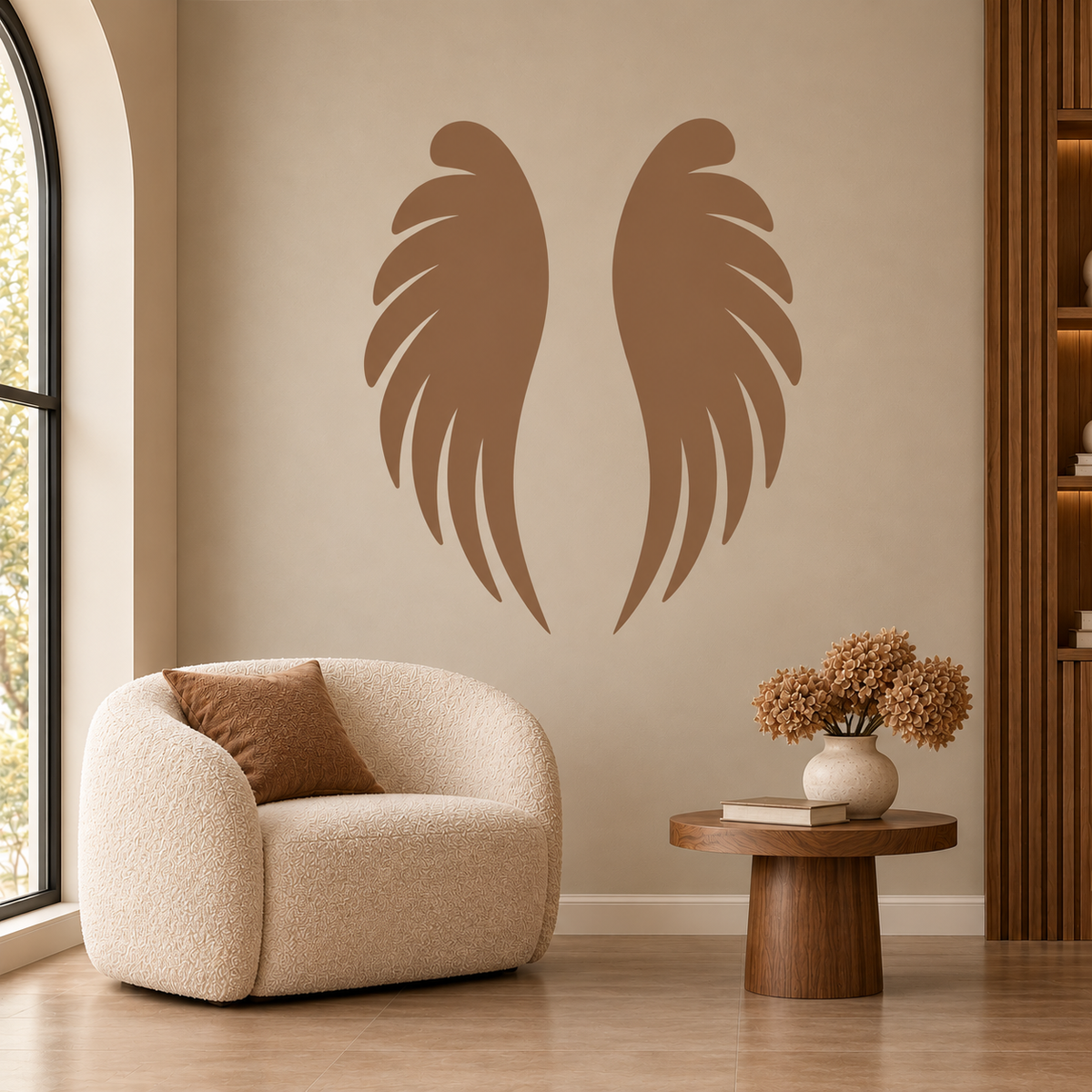 Angel Wings Stencil in warm taupe on a beige wall above a cream armchair in a cozy modern living room.
