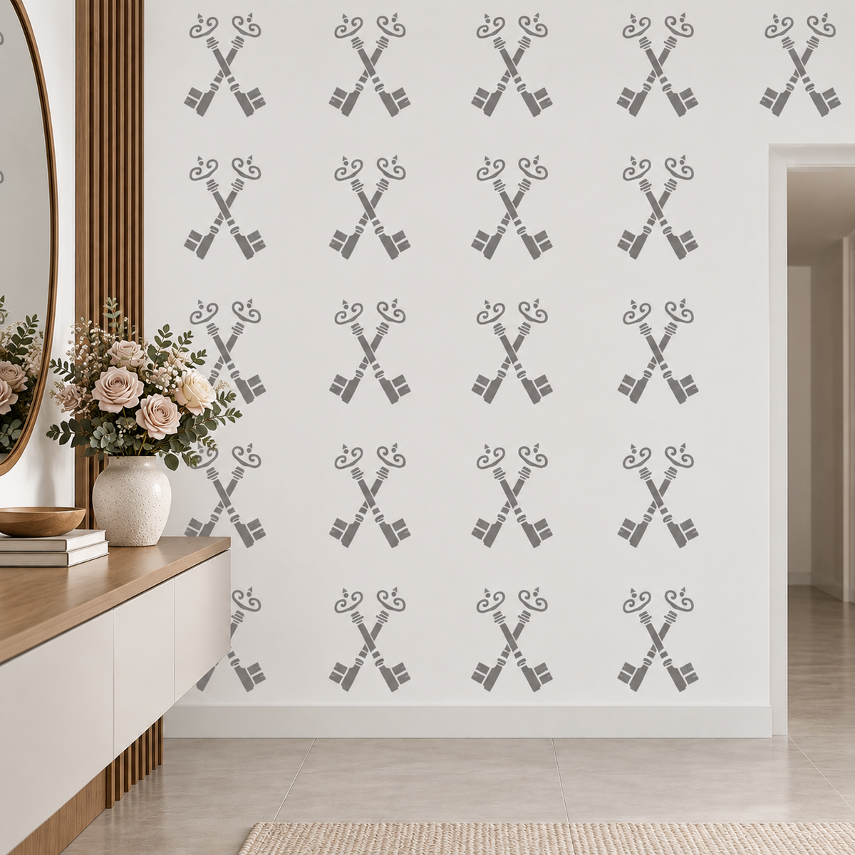 Antique Keys Stencil in soft gray featuring a repeating crossed keys pattern on a white wall in a minimalist entryway.