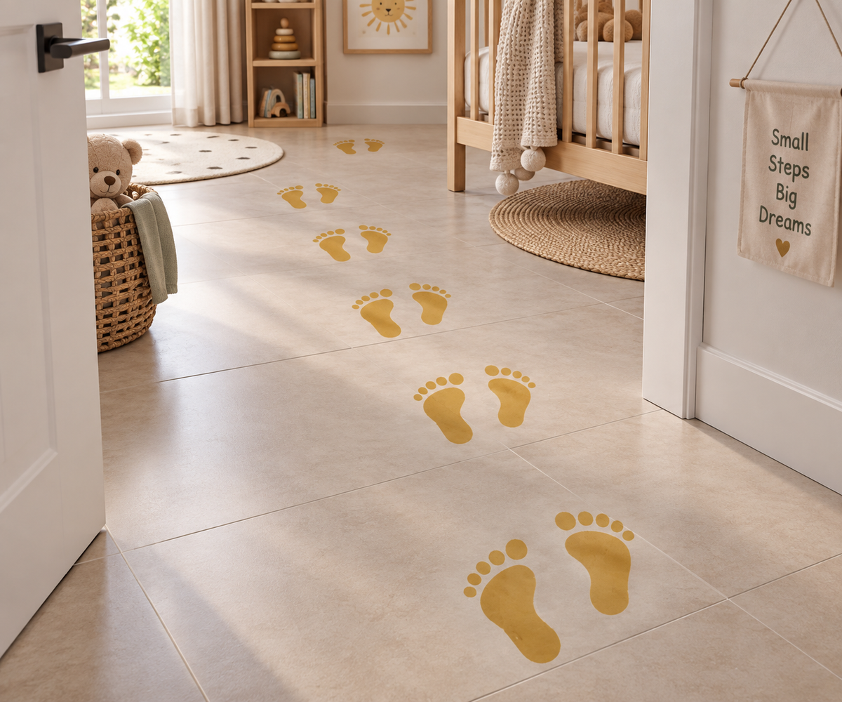Mustard yellow baby footprint stencil creating a playful walking trail across a neutral nursery floor.