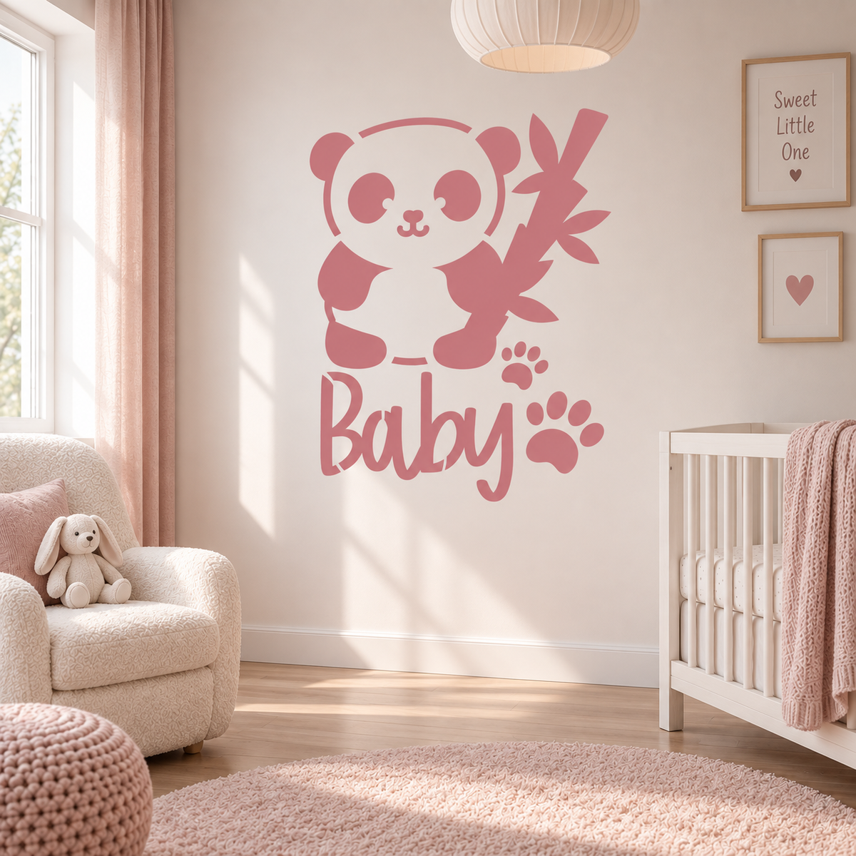 Pink baby panda wall stencil with bamboo and paw prints in a soft pastel nursery.
