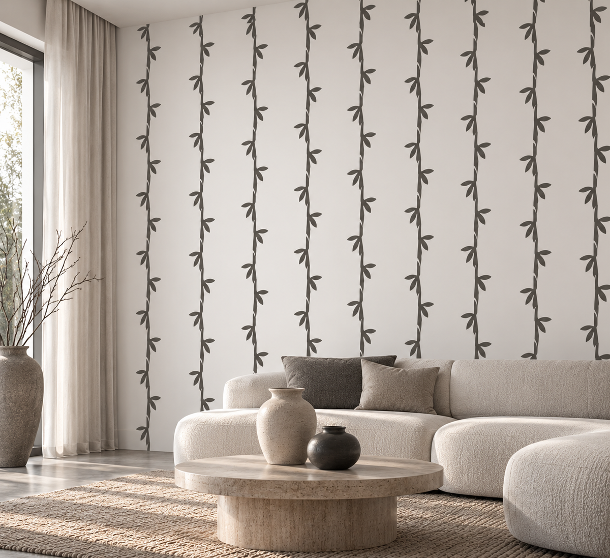 Bamboo Leaf Stencil in charcoal gray on a white wall in a modern neutral living room.
