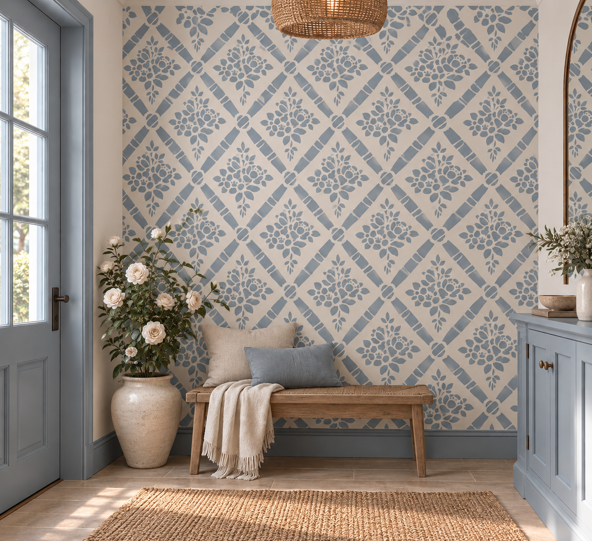 Blue floral diamond wall stencil pattern in a bright entryway with a wooden bench and soft neutral decor.