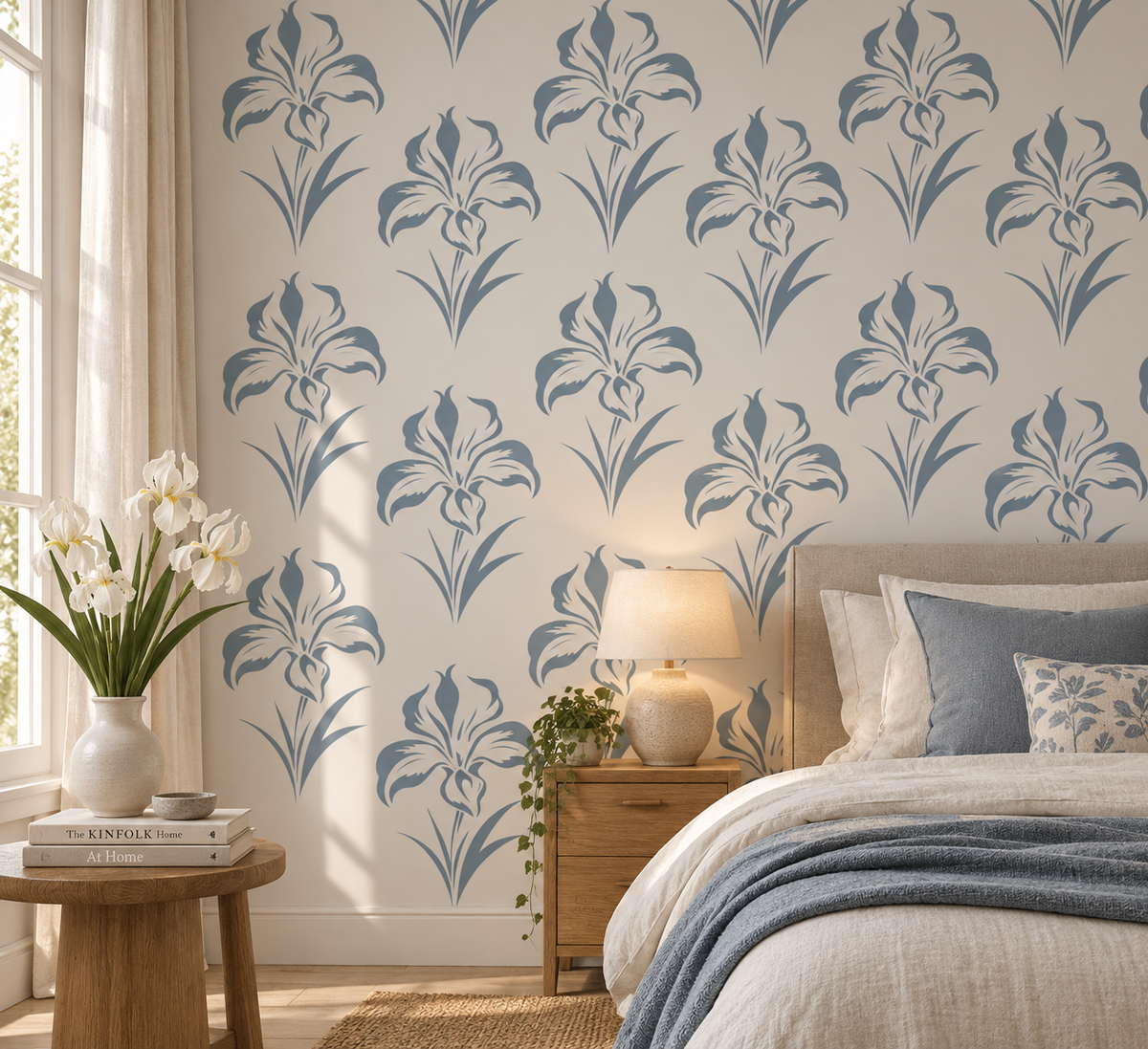 Blue iris flower wall stencil pattern creating a soft floral wallpaper effect in a bright modern bedroom.