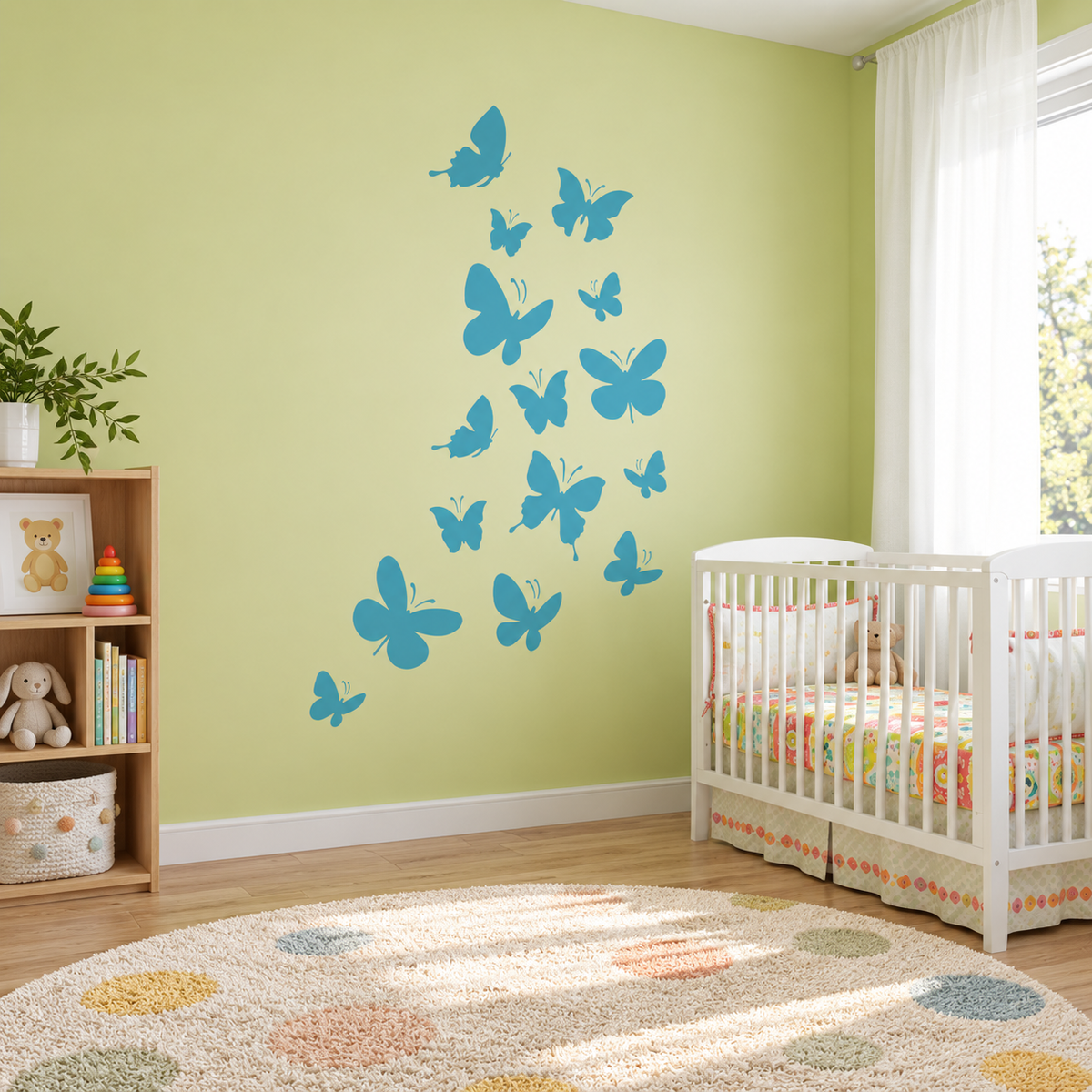 Butterfly Stencil in bright blue on a soft green nursery wall