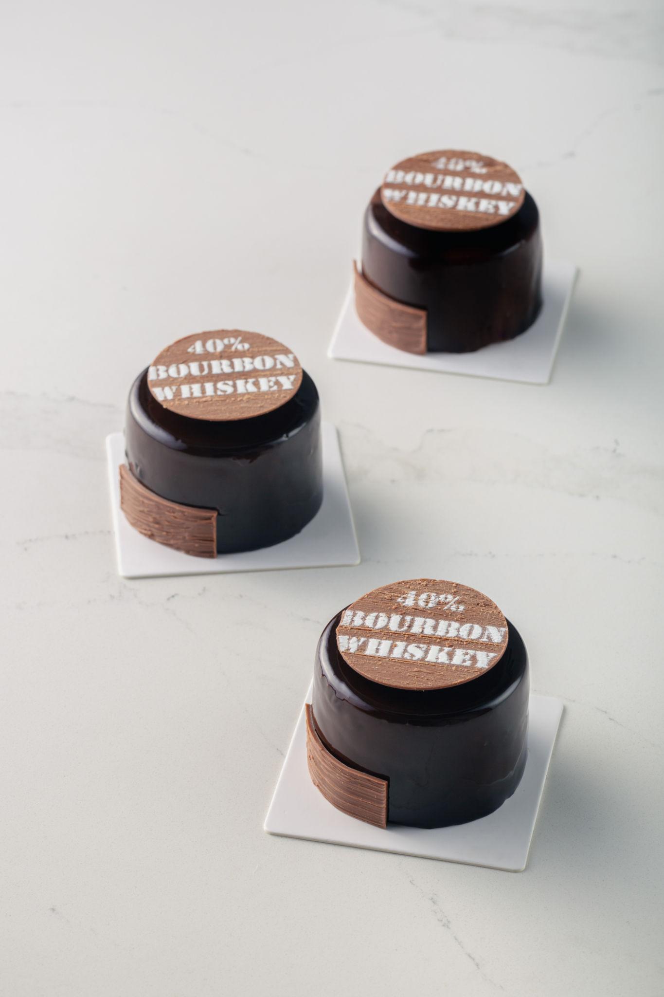 cake stencil letters on chocolate desserts with bourbon whiskey text decoration