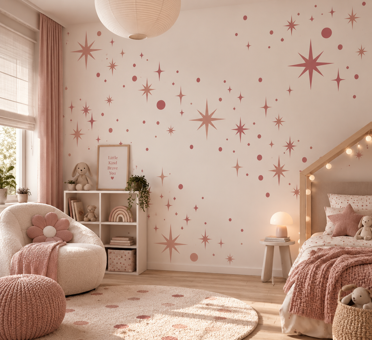 Dusty pink celestial starburst wall stencils with stars and dots decorating a soft neutral girls bedroom.
