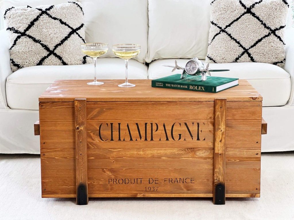 Vintage champagne wooden crate with stenciled lettering used as a coffee table in home decor