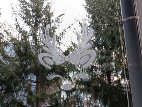 Christmas reindeer face stencil with a bow and eyelashes for window art