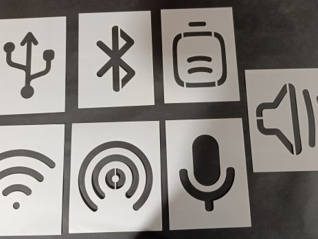 Set of classroom stencils with technology symbols including USB, Bluetooth, battery, volume, WiFi, podcast, and microphone icons