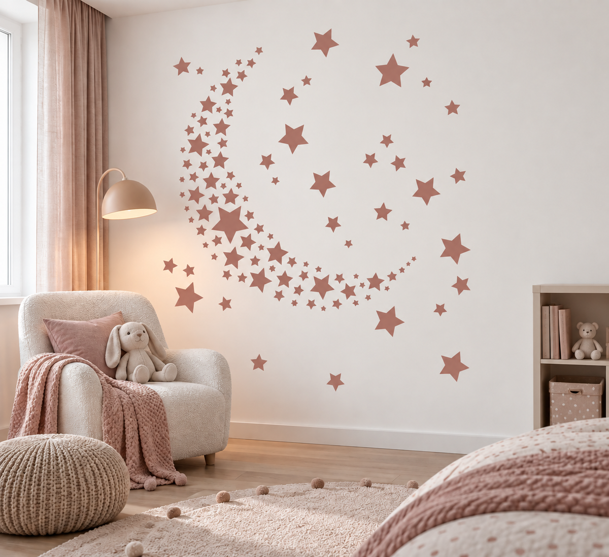 Dusty pink crescent star cluster wall stencil in a soft neutral kids bedroom.