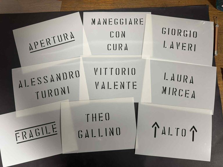 Custom letter stencils used for industrial names and labels, featuring bold cut-out typography for marking surfaces and equipment.