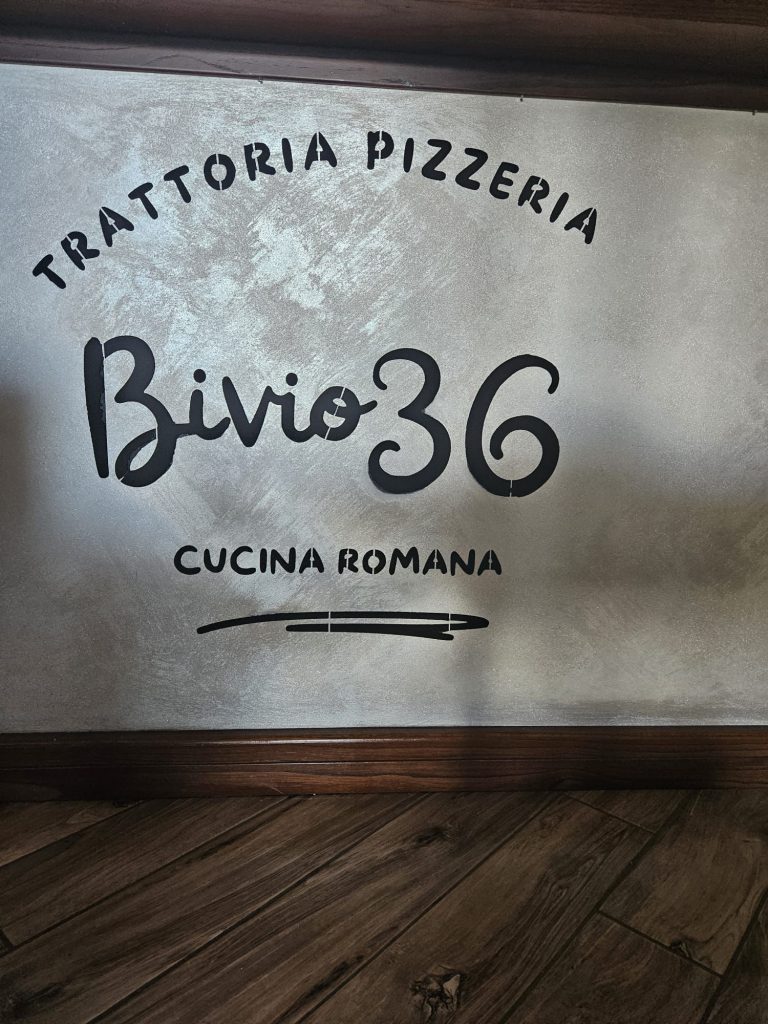 Custom stencil logo applied on a wall for Pizzeria Bivio36, featuring bold typography and a clean, modern design.