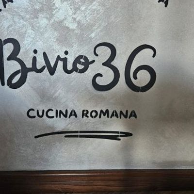 Custom stencil with Bivio36 logo applied on interior wall of Roman pizzeria