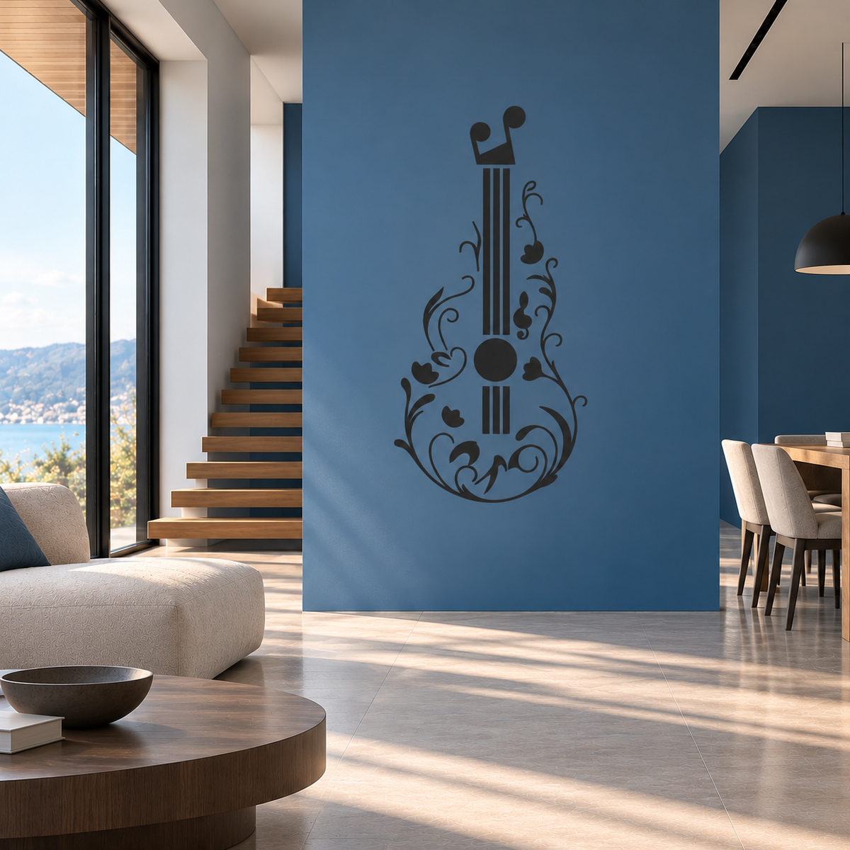 Black ornamental guitar wall stencil featuring delicate flowers and swirling vines on a blue accent wall in a modern living room.