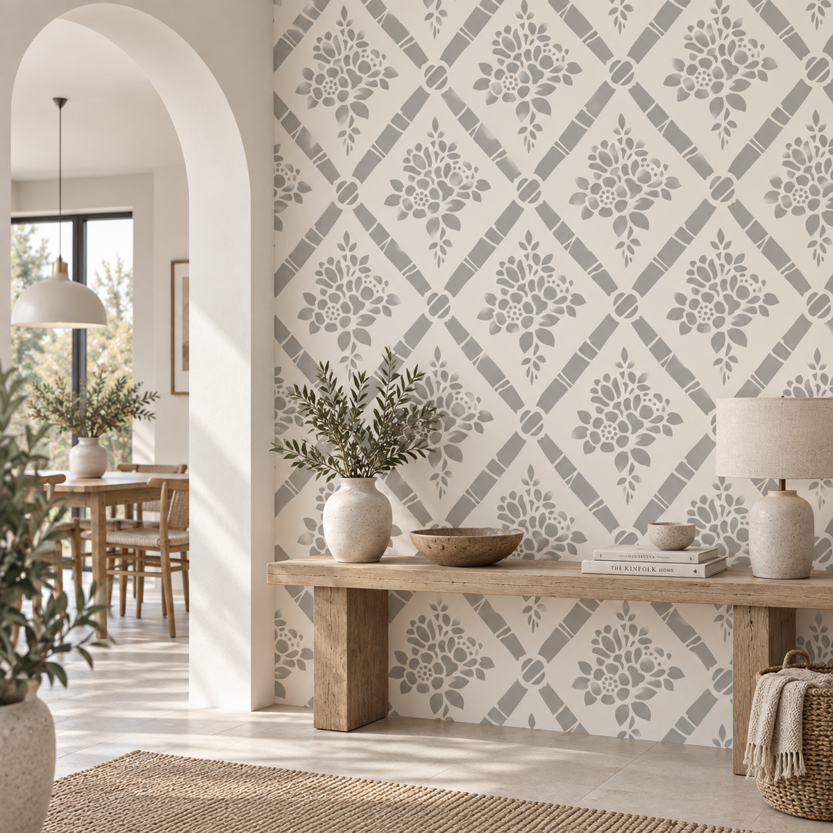 Floral diamond wall stencil pattern in a bright modern entryway with natural wood furniture.