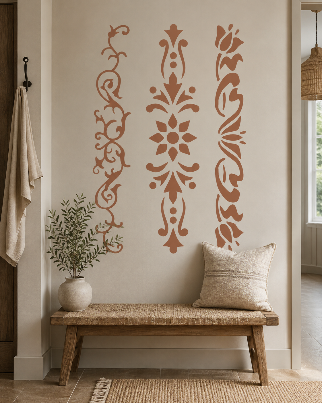 Floral scroll border stencil set creating elegant vertical wall decoration in a warm entryway