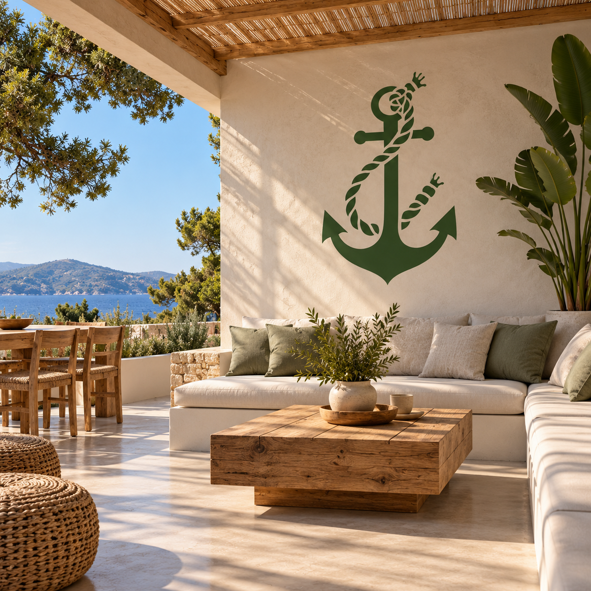 Green Anchor with Twisted Rope Stencil decorating a Mediterranean terrace wall above an outdoor sofa, creating a relaxed coastal home style.