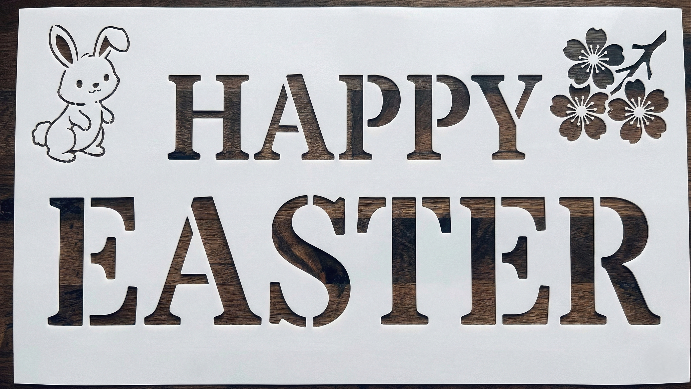 Happy Easter stencil with bunny and spring flowers – reusable stencil for Easter crafts and decorations.