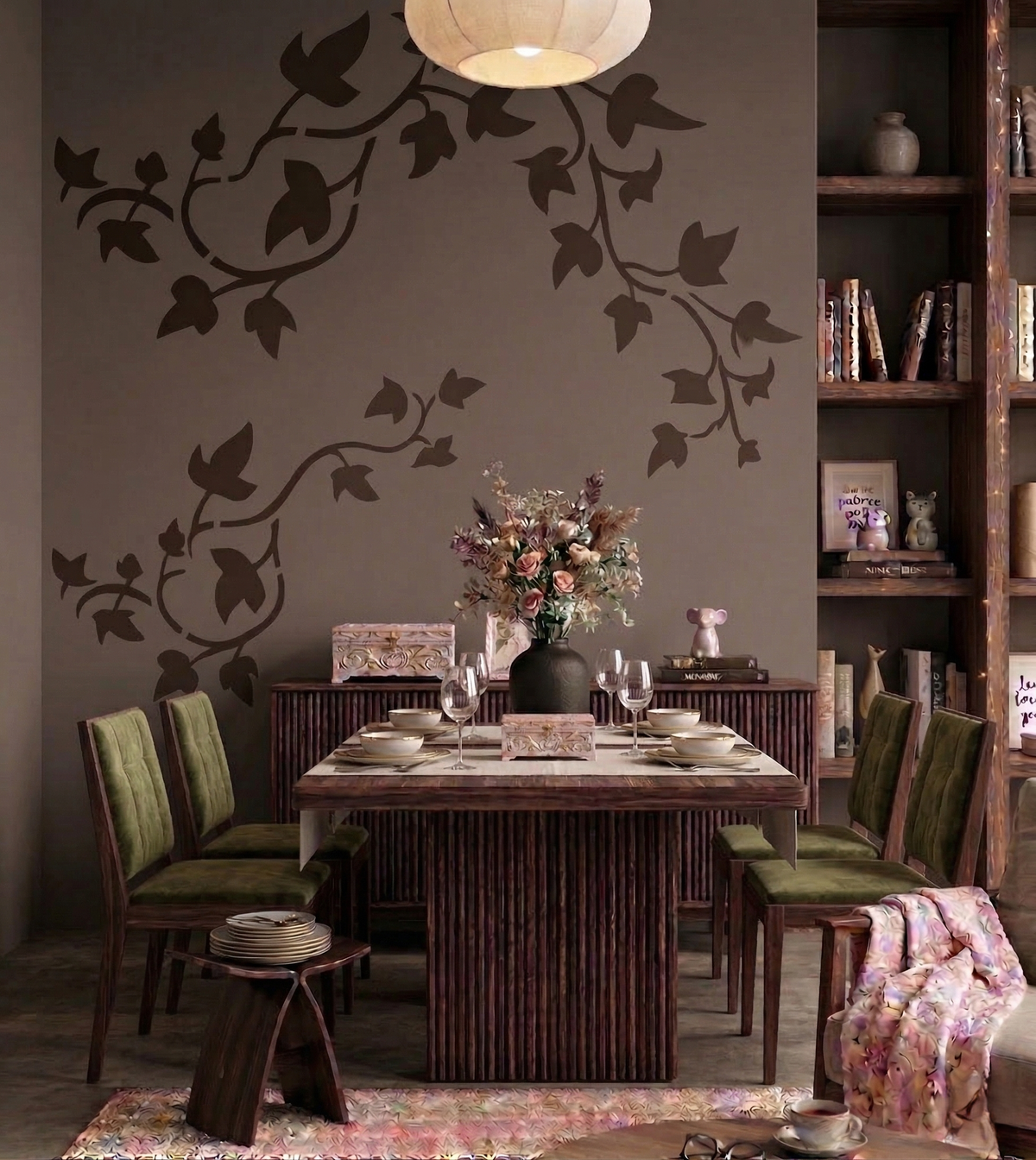 Ivy vine stencil with flowing leafy branches painted in dark tones on a soft neutral wall, creating an elegant botanical accent in a warm dining room with wooden furniture, ambient lighting, and decorative styling.