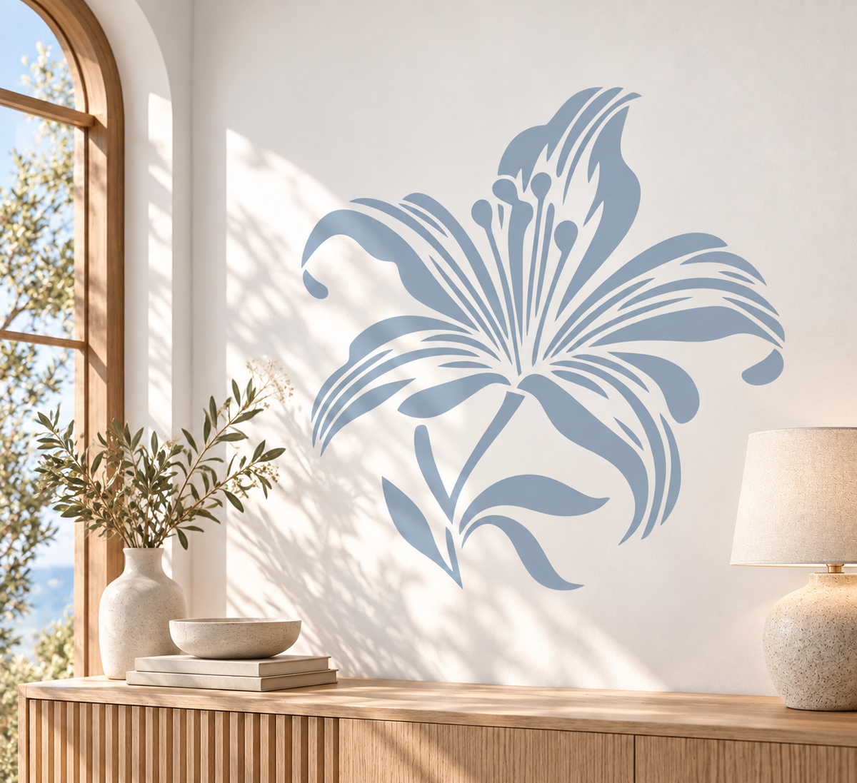 Large blue lily flower wall stencil in a bright modern interior with warm wood furniture and natural sunlight