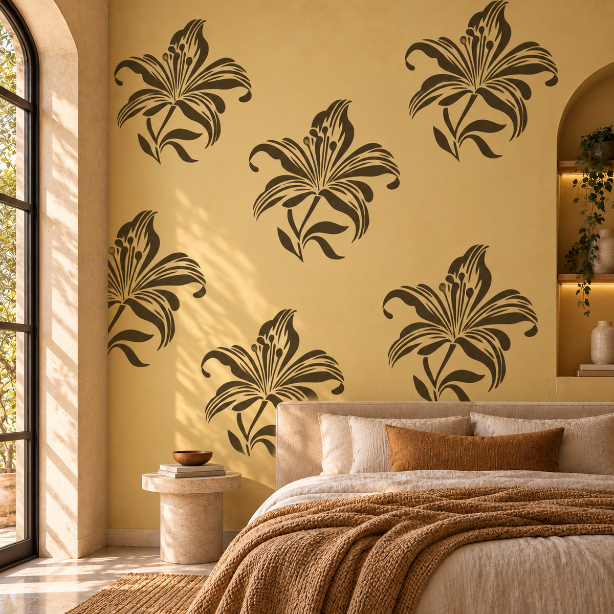 Large lily flower stencil pattern in dark brown on a warm ochre bedroom wall with neutral bedding