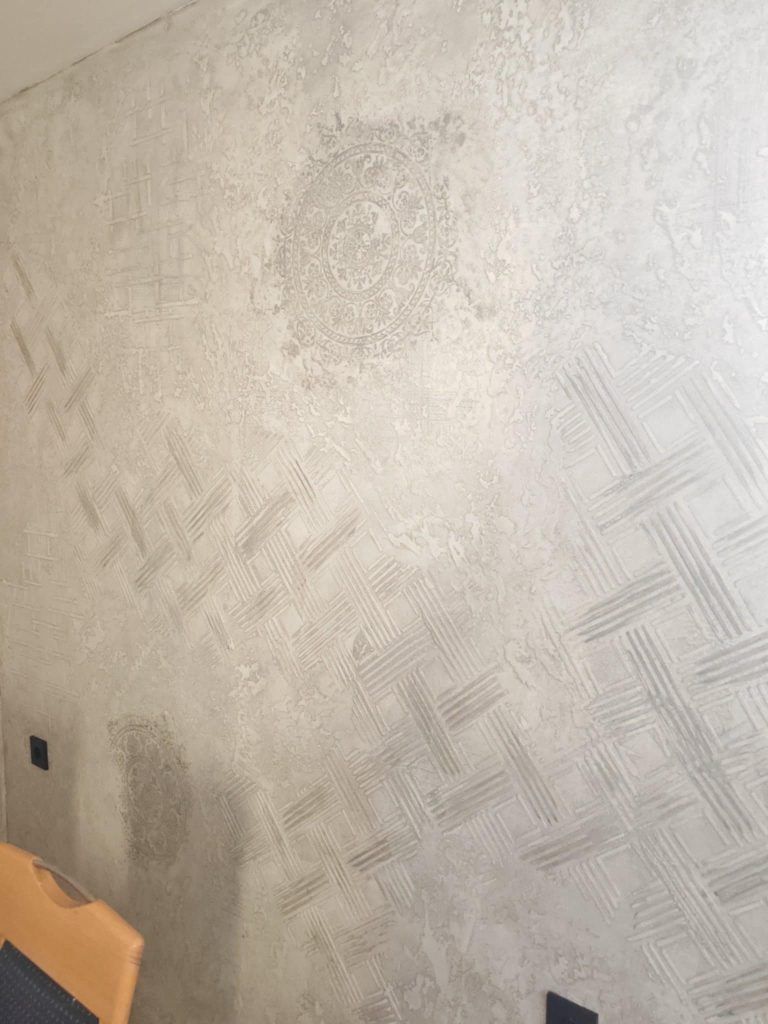 Dining room decorated with modern wall stencils adding elegance and style