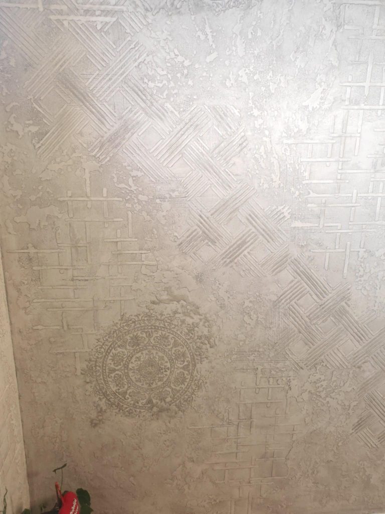 Dining room decorated with modern wall stencils showcasing elegant geometric patterns