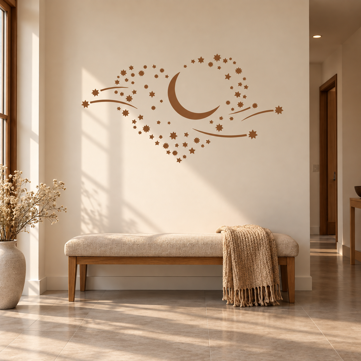 Moon and Stars Stencil in warm brown on a cream wall above an upholstered bench in a modern entryway.