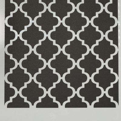 Repeating Moroccan-style geometric stencil pattern sheet with interlocking quatrefoil design in black and white.