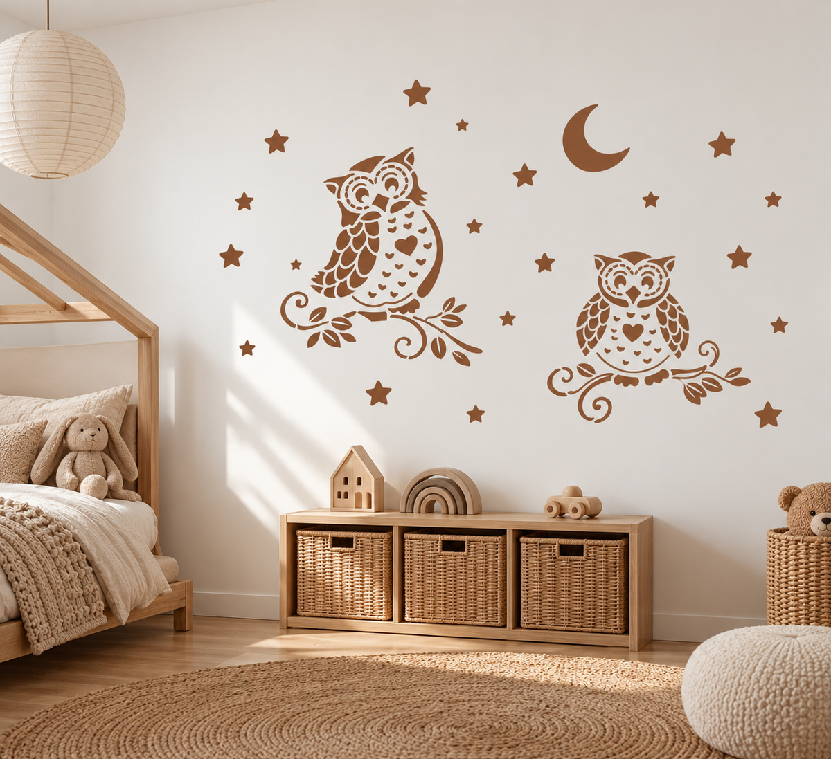 Night Owl Stencil in warm brown with stars and moon on a white wall in a cozy kids bedroom