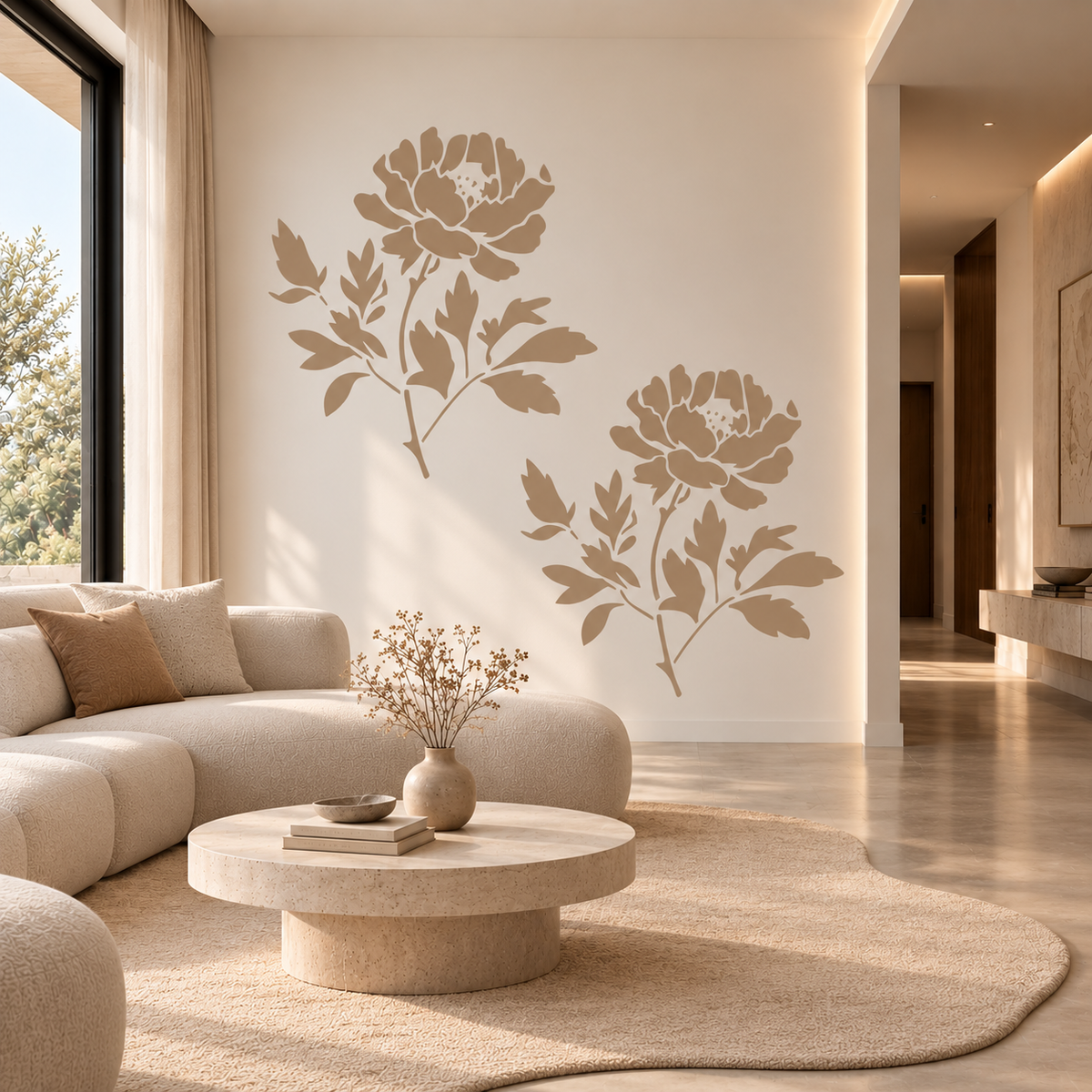 Peony flower wall stencil in soft beige tones on an accent wall in a modern minimalist living room with a curved sofa   