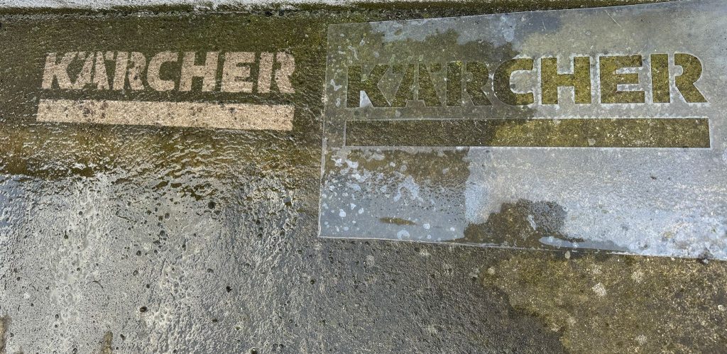 Custom pressure washer stencil showing before and after reverse graffiti effect on concrete