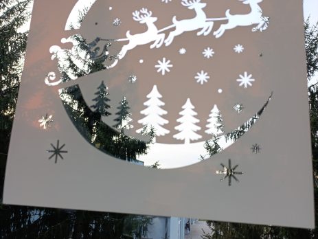 Santa’s sleigh window stencil applied on glass, creating a festive holiday silhouette decoration.