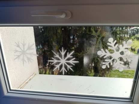 Snowflake stencils applied on a window with a frosted effect