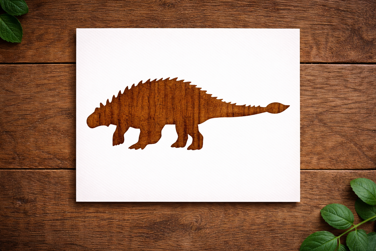Spinosaurus dinosaur stencil cutout design on white stencil sheet placed on wooden background.