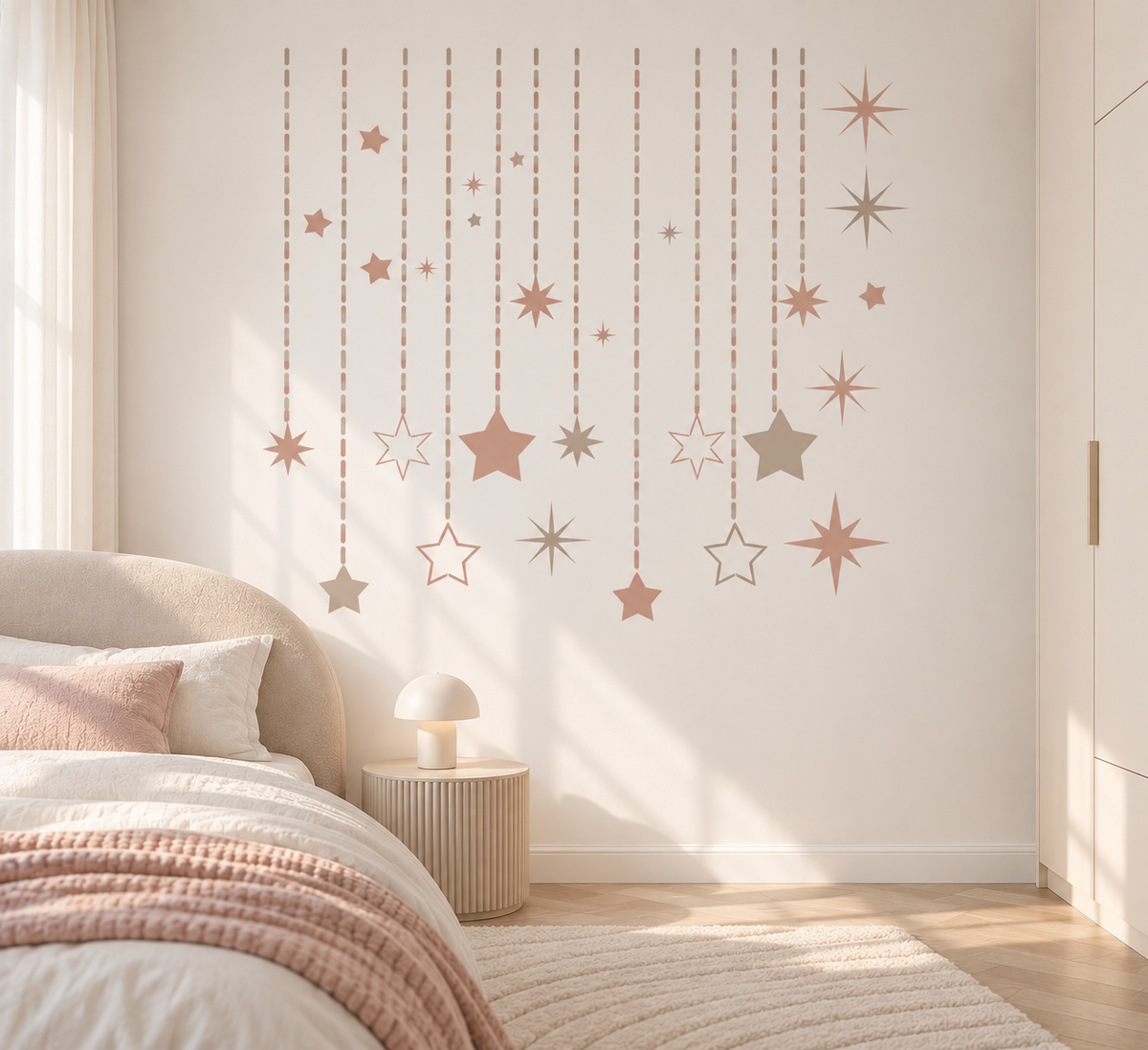 Starry Cascade wall stencil with hanging dashed lines and pastel stars decorating a soft neutral bedroom.