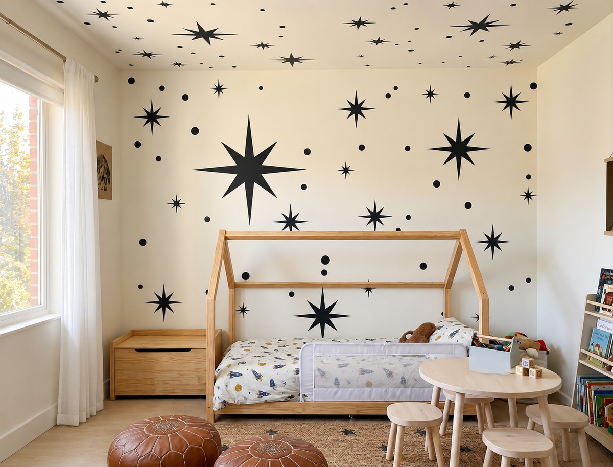 Starry sky wall stencil with scattered stars and dots in a cozy kids room with wooden furniture and soft natural light.