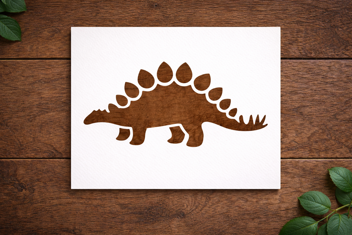 Reusable Stegosaurus dinosaur stencil made from 300 micron Mylar plastic placed on wooden background.