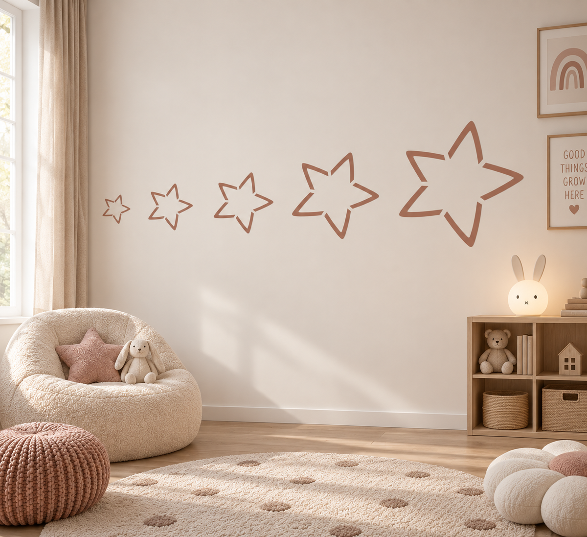 Growing outlined star wall stencil in a soft neutral kids room with warm blush and natural wood decor.