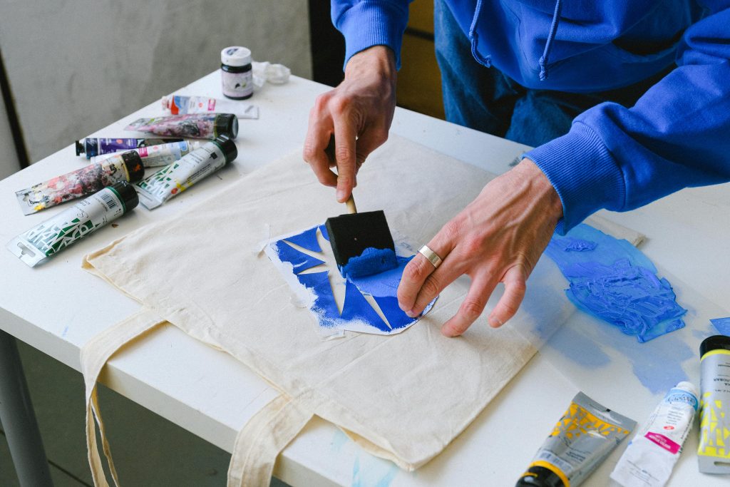Decorative techniques with stencils on textile bag during stencil preparation