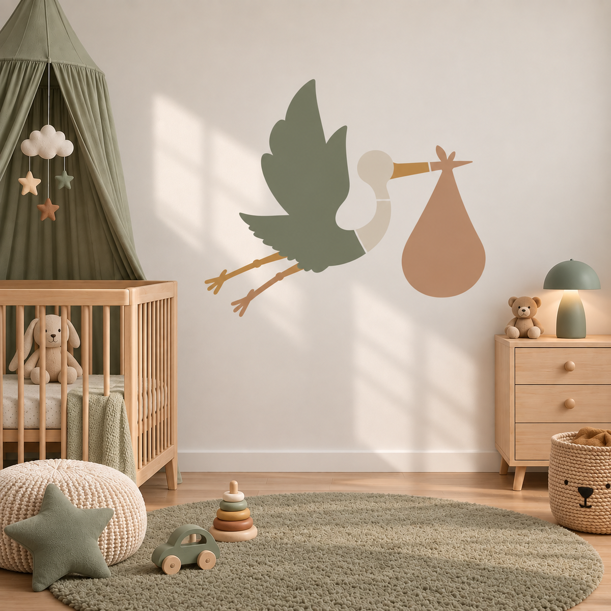Sage green stork and baby wall stencil in a warm neutral nursery.