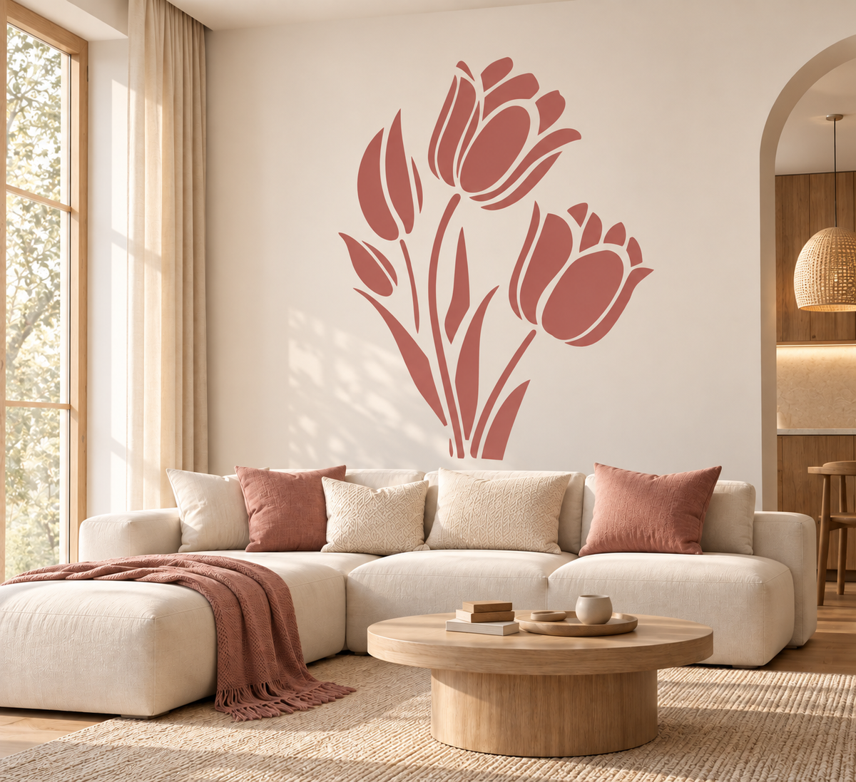 Tulip Flower Stencil in dusty rose painted as a large floral wall accent above a cream sofa in a modern living room.
