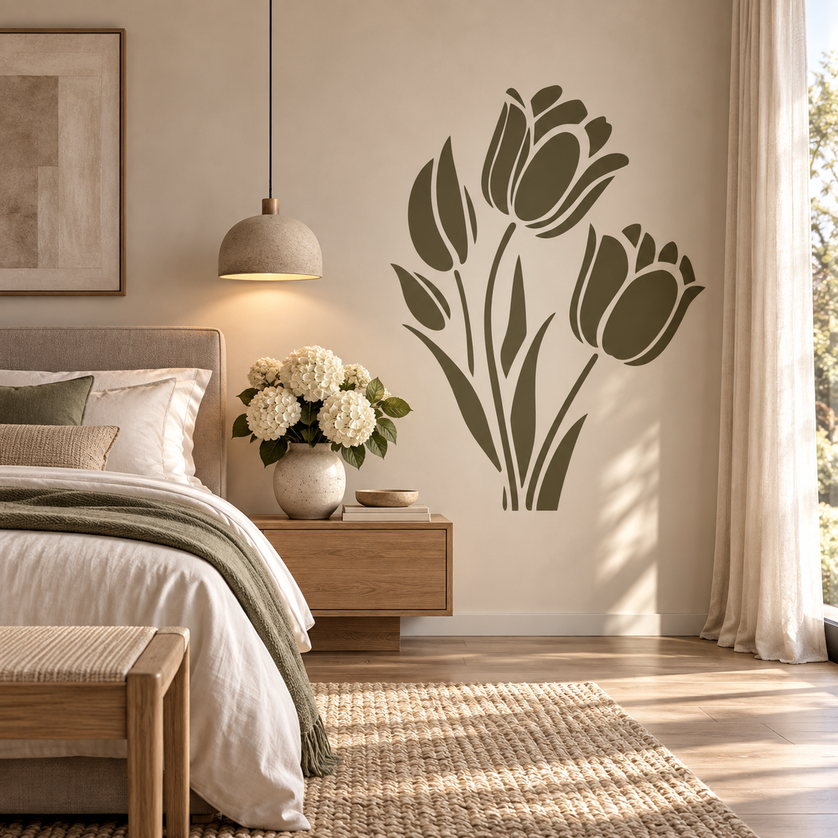 Tulip Flower Stencil in olive green painted as a large floral wall accent beside a bed in a warm modern bedroom.