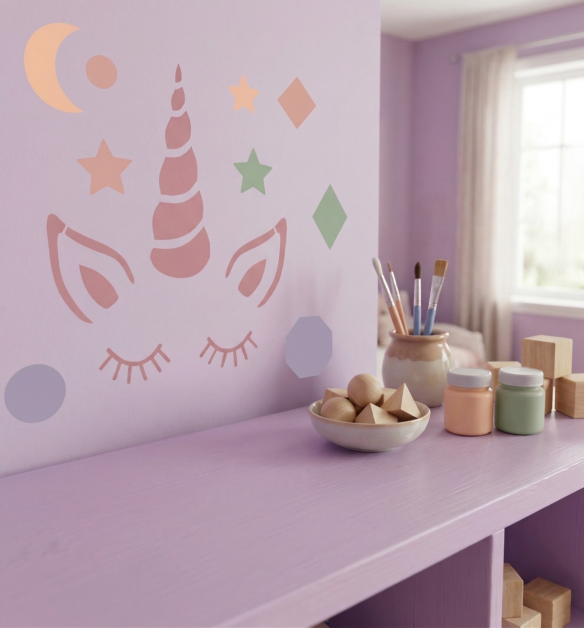 Cute unicorn face stencil with pastel stars and moon on wall for kids room decor