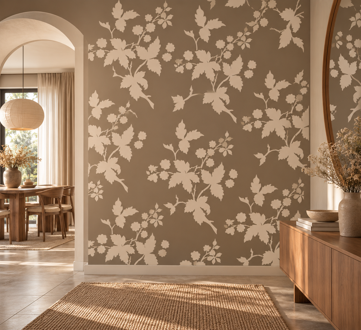 Wild berry branch wall stencil in warm cream repeated across a taupe accent wall in a bright modern interior