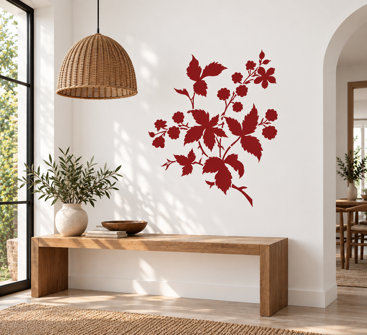 Wild berry branch wall stencil in deep red featuring botanical leaves, flowers and berries above a wooden entryway bench